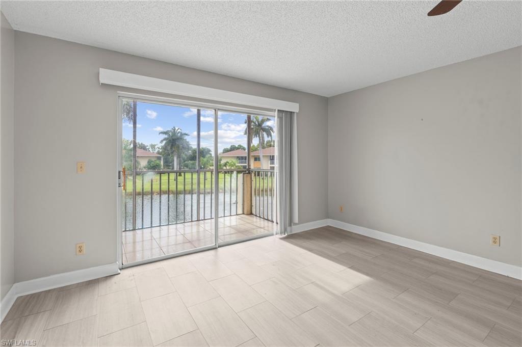 6184 Michelle Way, Unit 243 Fort Myers, FL 33919 - Photo 4 of 21 a view of a room with sliding glass door