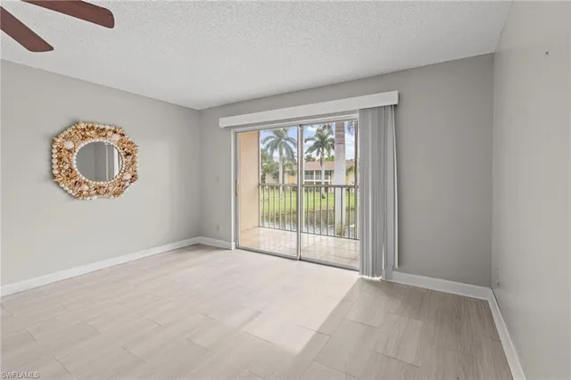 an empty room with a large window