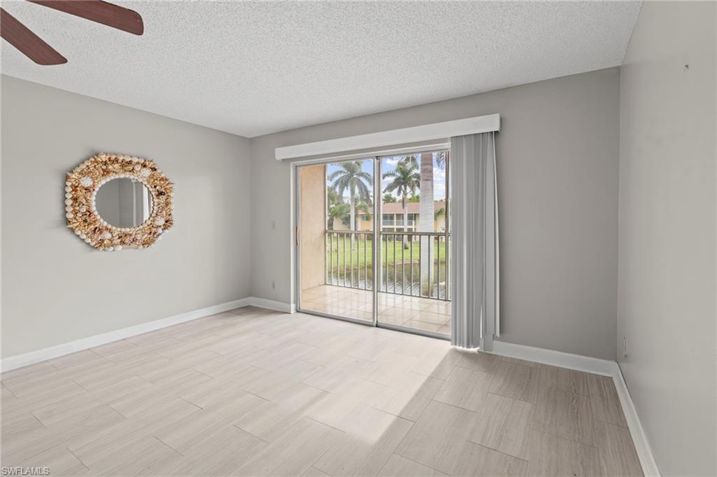 6184 Michelle Way, Unit 243 Fort Myers, FL 33919 - Photo 5 of 21 an empty room with a large window