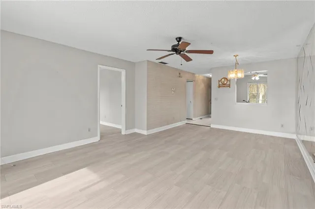 a view of a chandelier fan and entryway