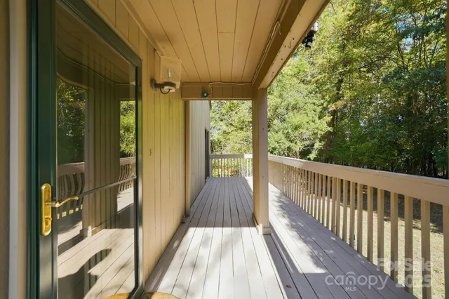a view of balcony with wooden floor