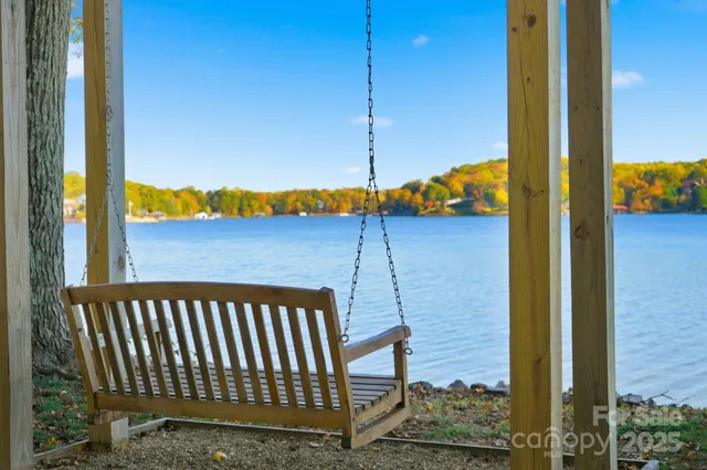 a view of a balcony with a floor to ceiling window and wooden floor