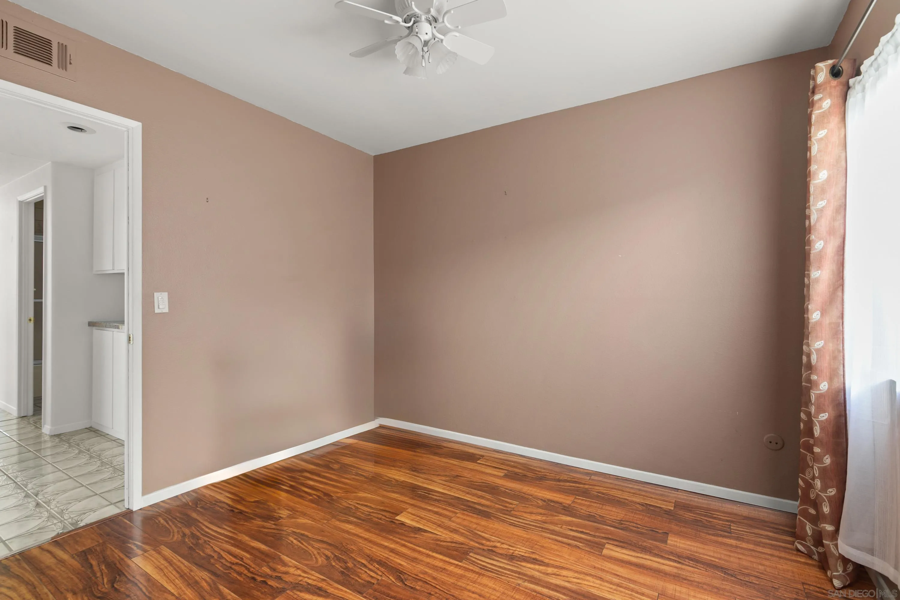 13840 Olive Grove Place Poway, CA 92064 - Photo 25 of 40 a view of empty room with wooden floor and fan
