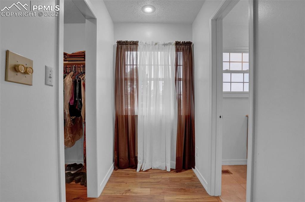 4930 Harvest Road Colorado Springs, CO 80917 - Photo 17 of 39 a view of a hallway with closet and bathroom