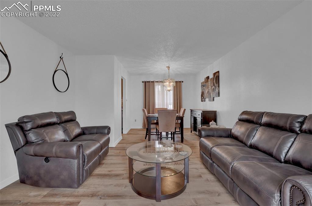 4930 Harvest Road Colorado Springs, CO 80917 - Photo 7 of 39 a living room with furniture and a large window