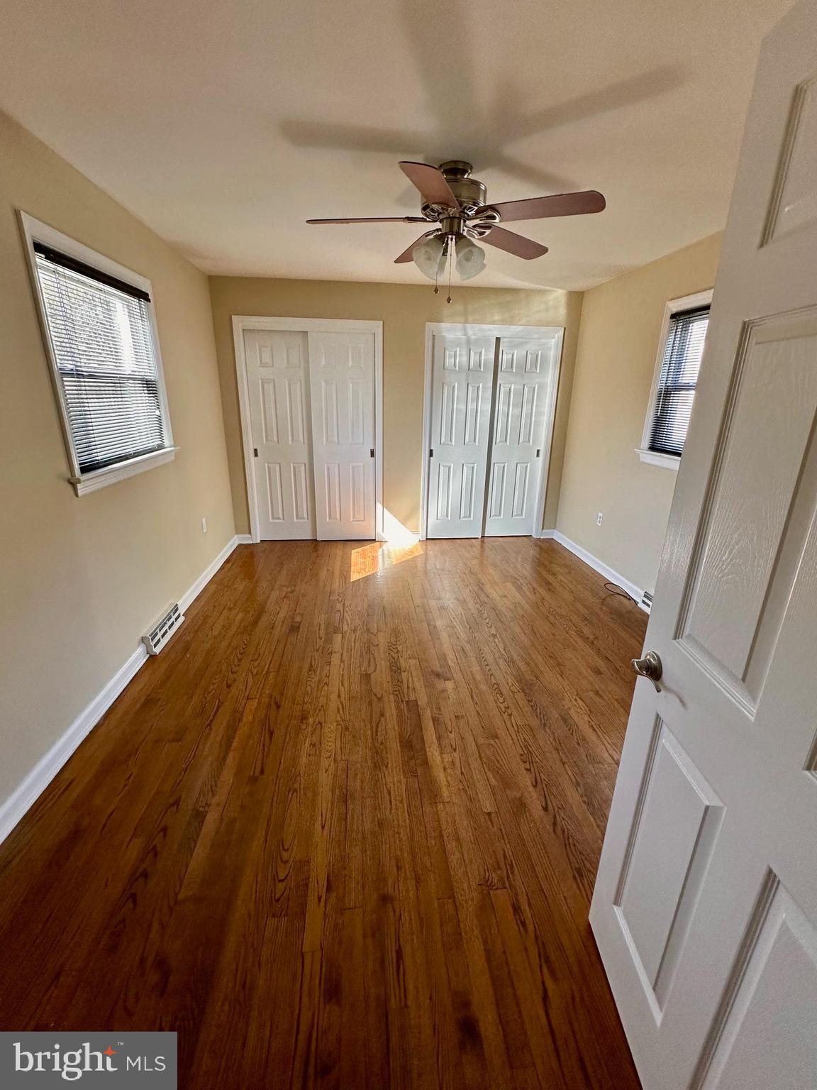 128 Central Avenue Ewing, NJ 08628 - Photo 5 of 15 a view of an empty room with wooden floor and a window