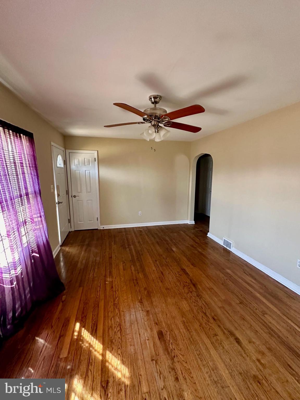 128 Central Avenue Ewing, NJ 08628 - Photo 7 of 15 a view of a room with wooden floor closet and a ceiling fan
