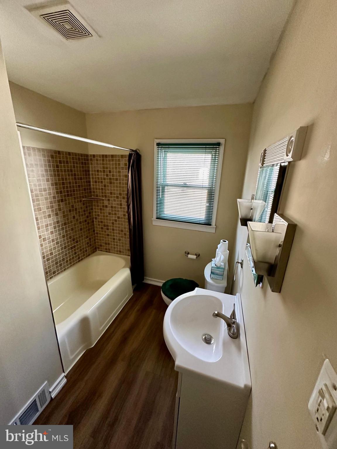 128 Central Avenue Ewing, NJ 08628 - Photo 8 of 15 a bathroom with a sink and a bathtub
