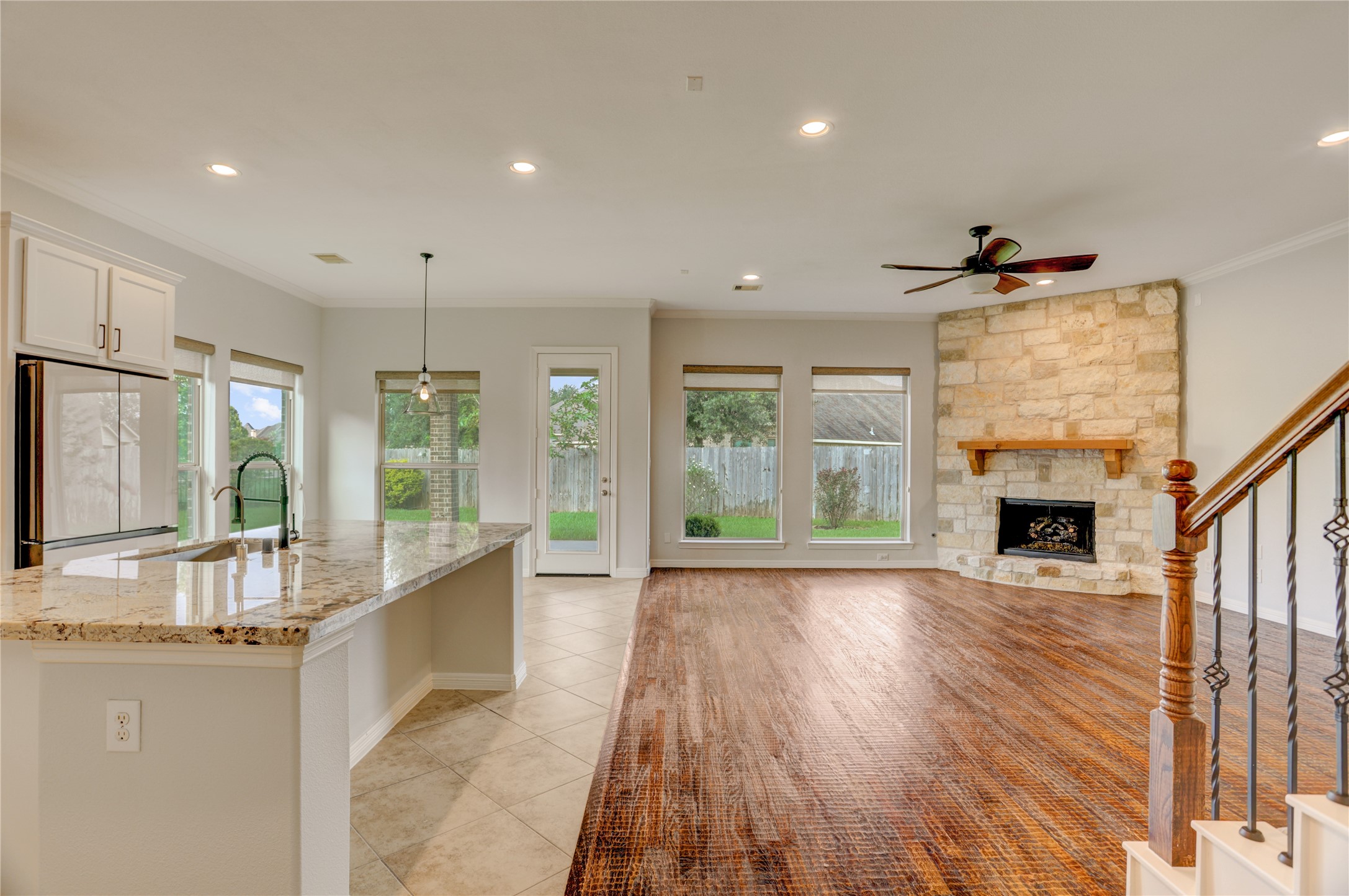 3002 Currant Drive Manvel, TX 77578 - Photo 7 of 43 a view of an entryway with wooden floor and a fireplace