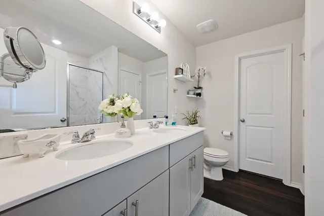 a bathroom with a shower and a glass door