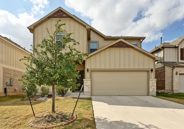 a view of a house with small yard
