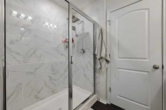 a bedroom with a bed and a mirror