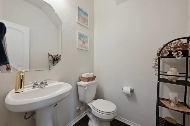 a bathroom with a sink and toilet