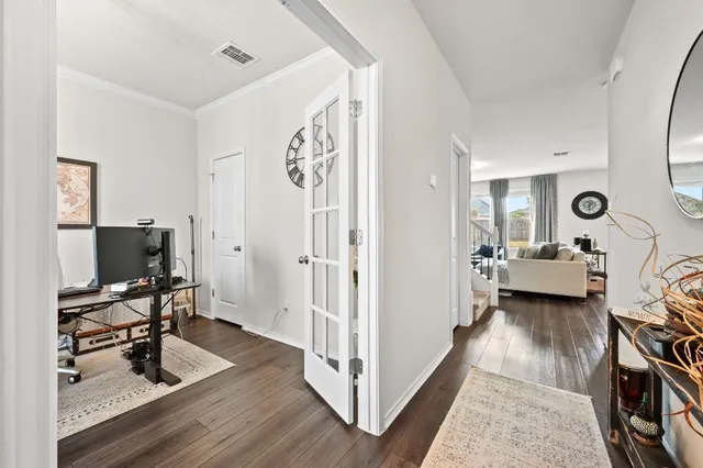 a view of a livingroom with a flat screen tv and a couch