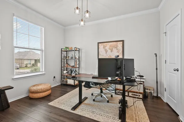 a workspace with furniture and window