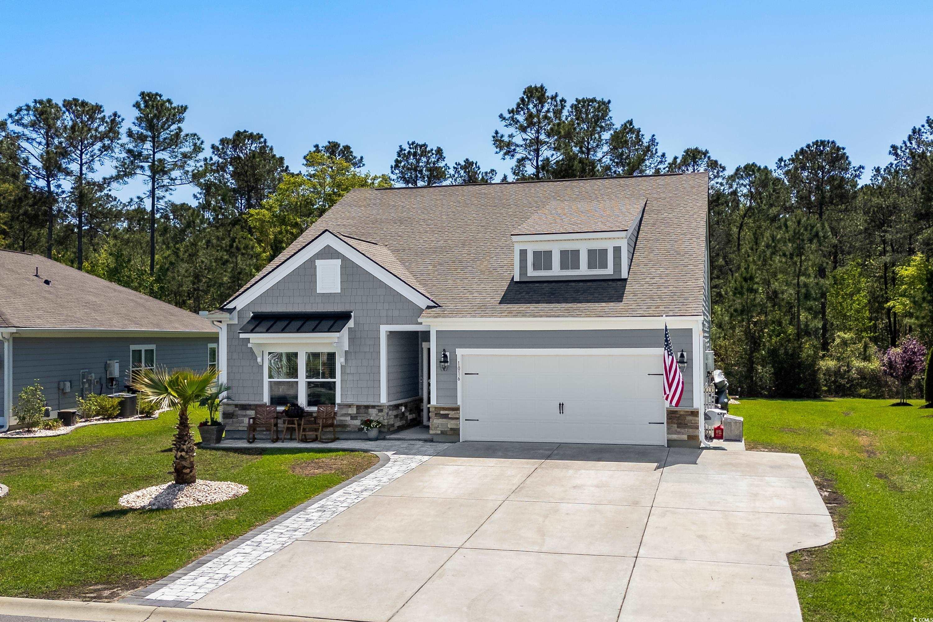 1016 Saluda River Road Murrells Inlet, SC 29576 - Photo 1 of 38 Craftsman-style house with concrete driveway, a fr