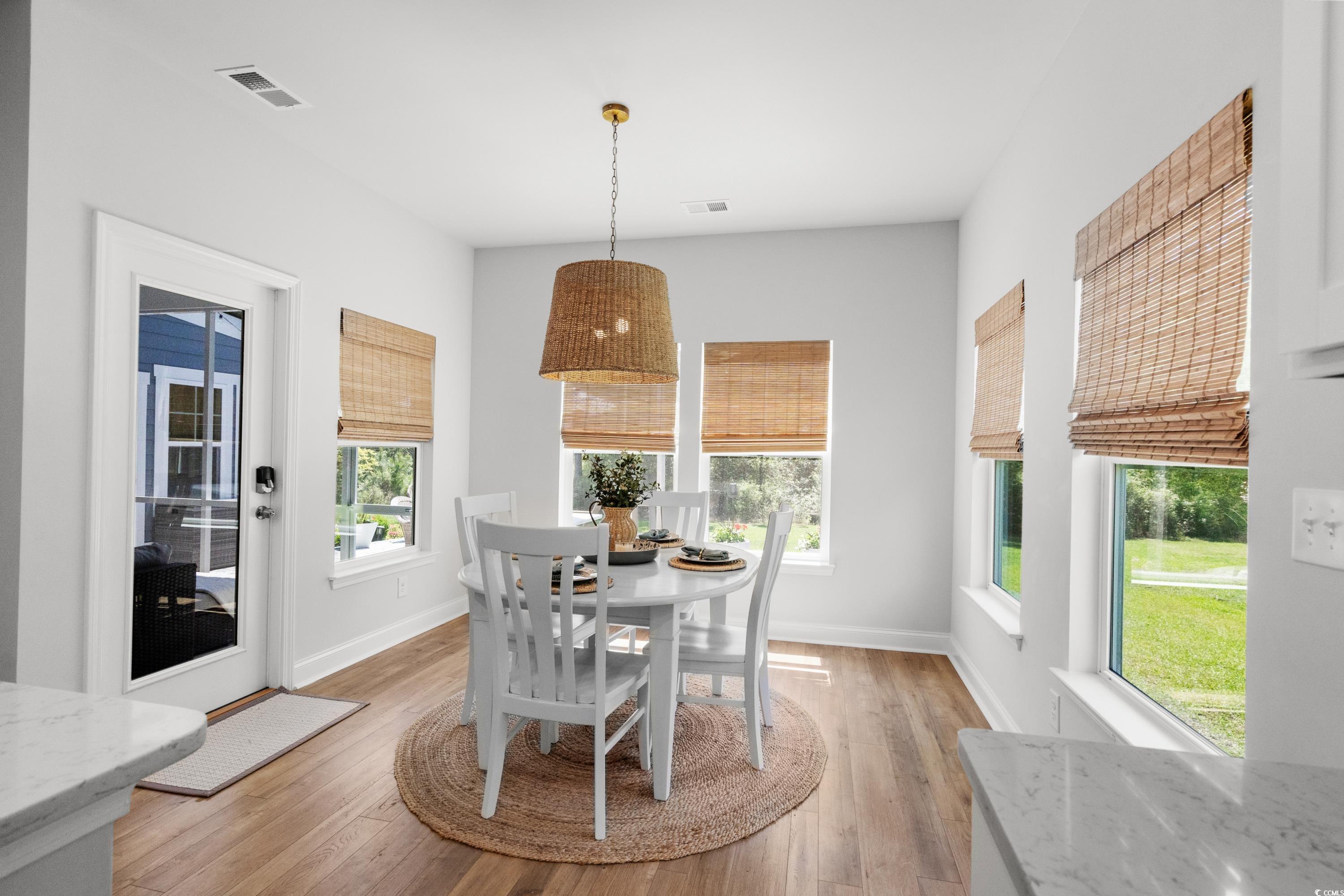 1016 Saluda River Road Murrells Inlet, SC 29576 - Photo 10 of 38 Dining area featuring light wood-style flooring, b