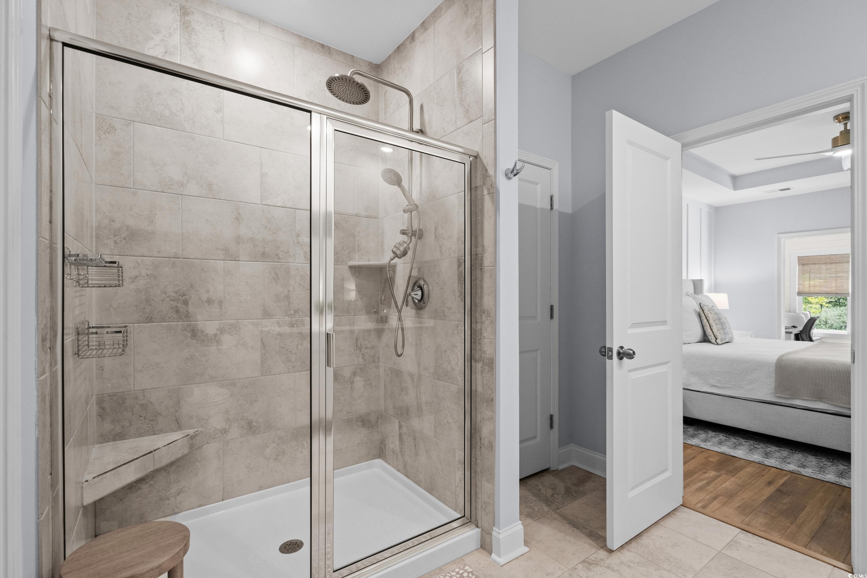 1016 Saluda River Road Murrells Inlet, SC 29576 - Photo 20 of 38 Ensuite bathroom featuring tile patterned floors,