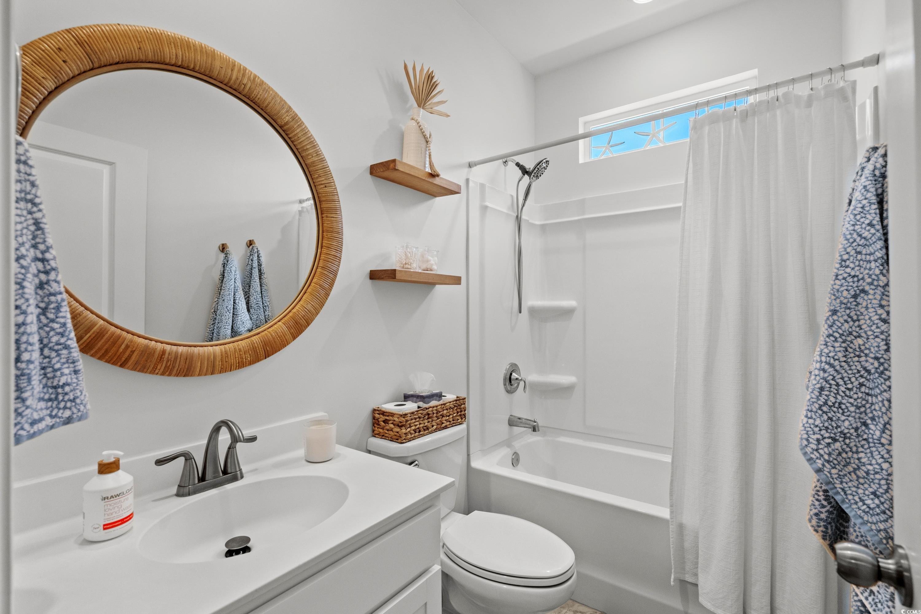 1016 Saluda River Road Murrells Inlet, SC 29576 - Photo 24 of 38 Bathroom featuring toilet, shower / bath combo, an