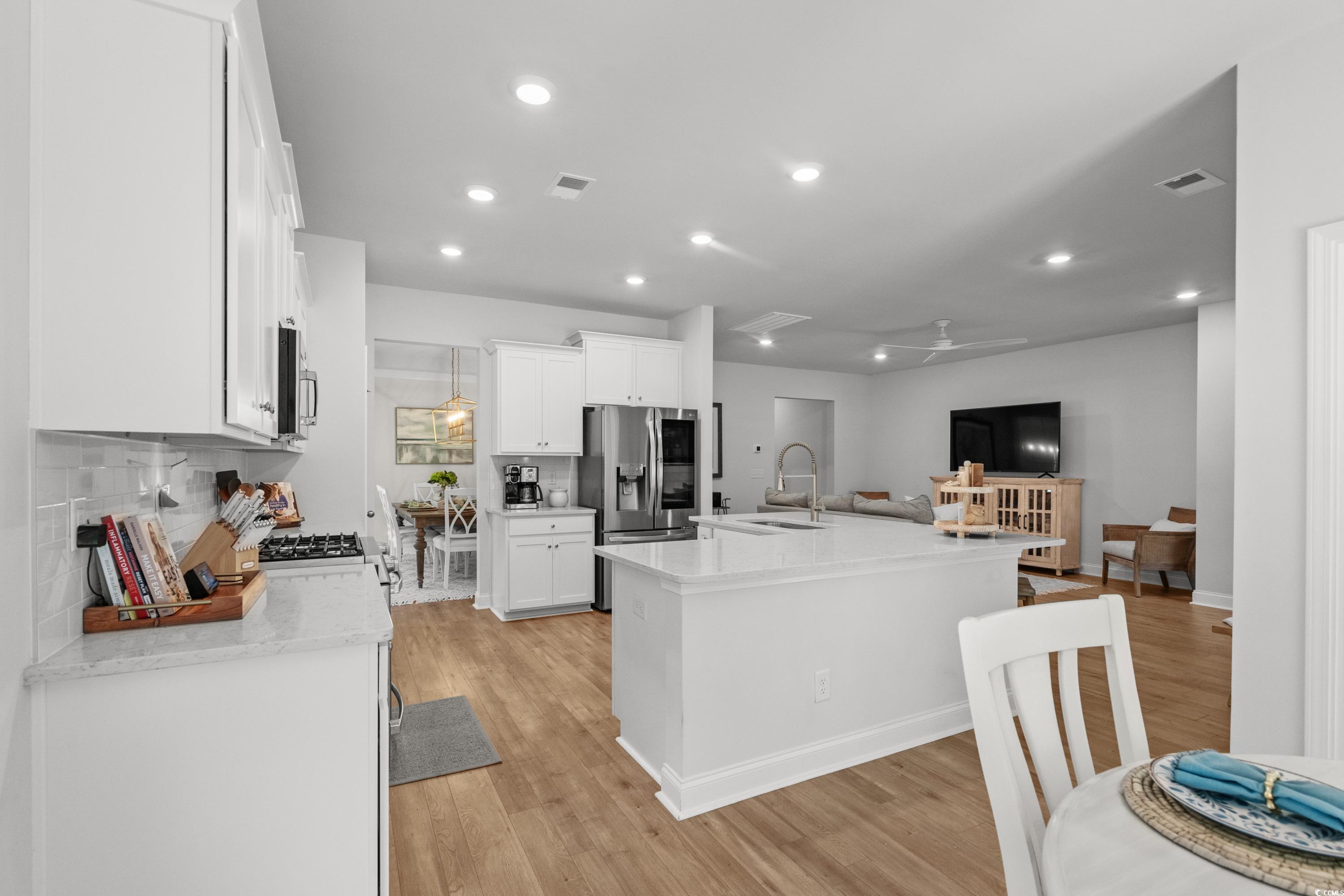 1016 Saluda River Road Murrells Inlet, SC 29576 - Photo 7 of 38 Kitchen with visible vents, a sink, open floor pla