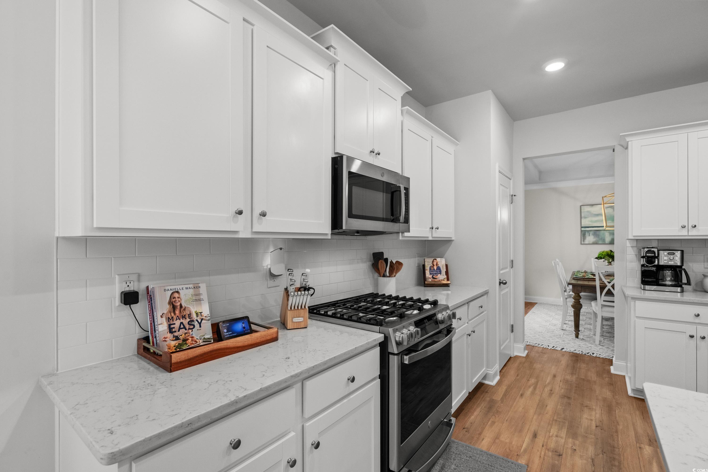 1016 Saluda River Road Murrells Inlet, SC 29576 - Photo 9 of 38 Kitchen with light wood finished floors, decorativ