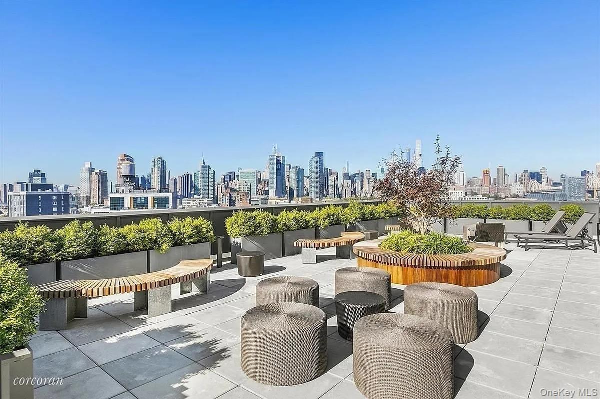 22-18 Jackson Avenue, Unit 304 Queens, NY 11101 - Photo 8 of 10 a view of a patio with couches and a table and chairs