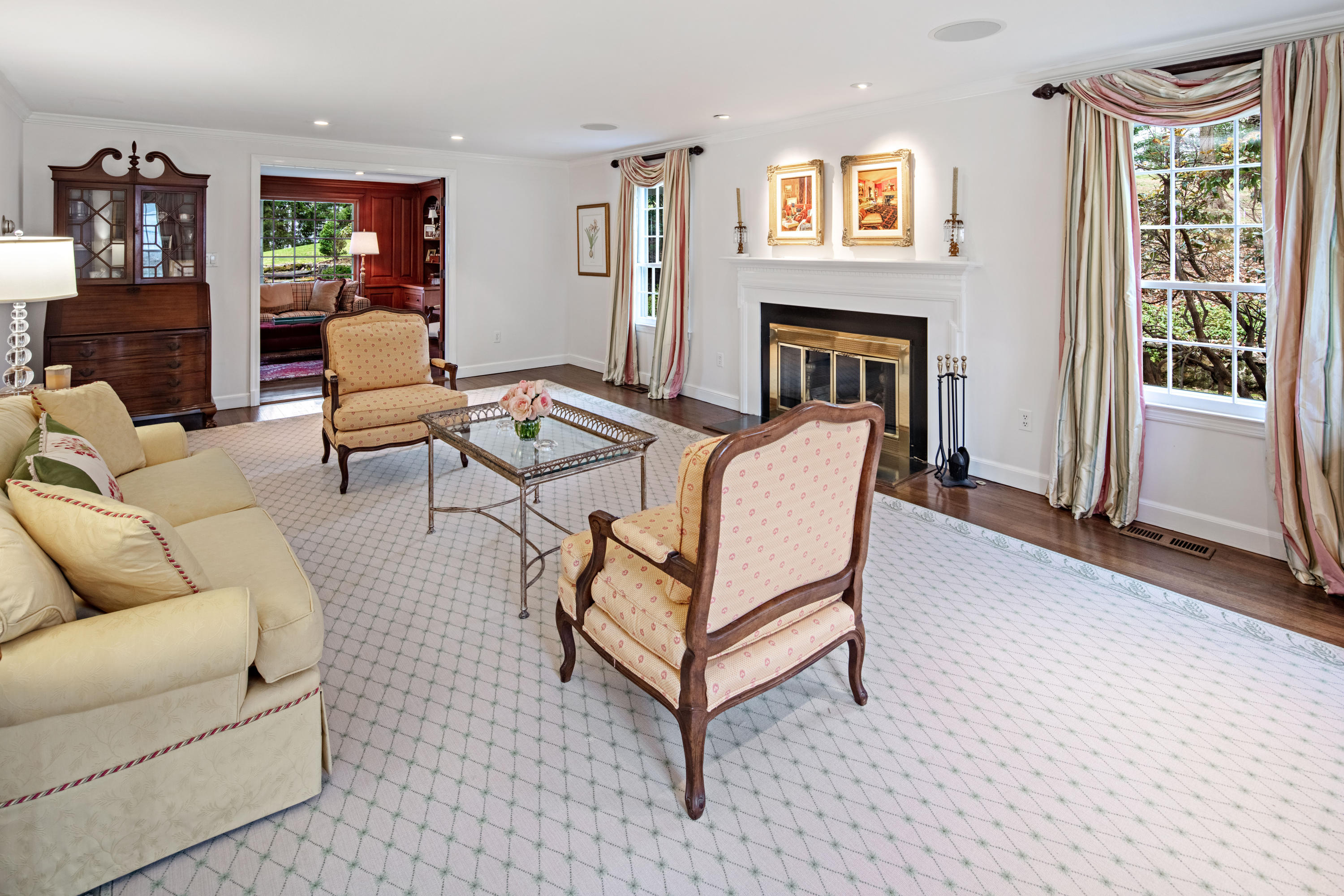 31 Harbor Road Darien, CT 06820 - Photo 22 of 39 a living room with furniture a fireplace and a flat screen tv