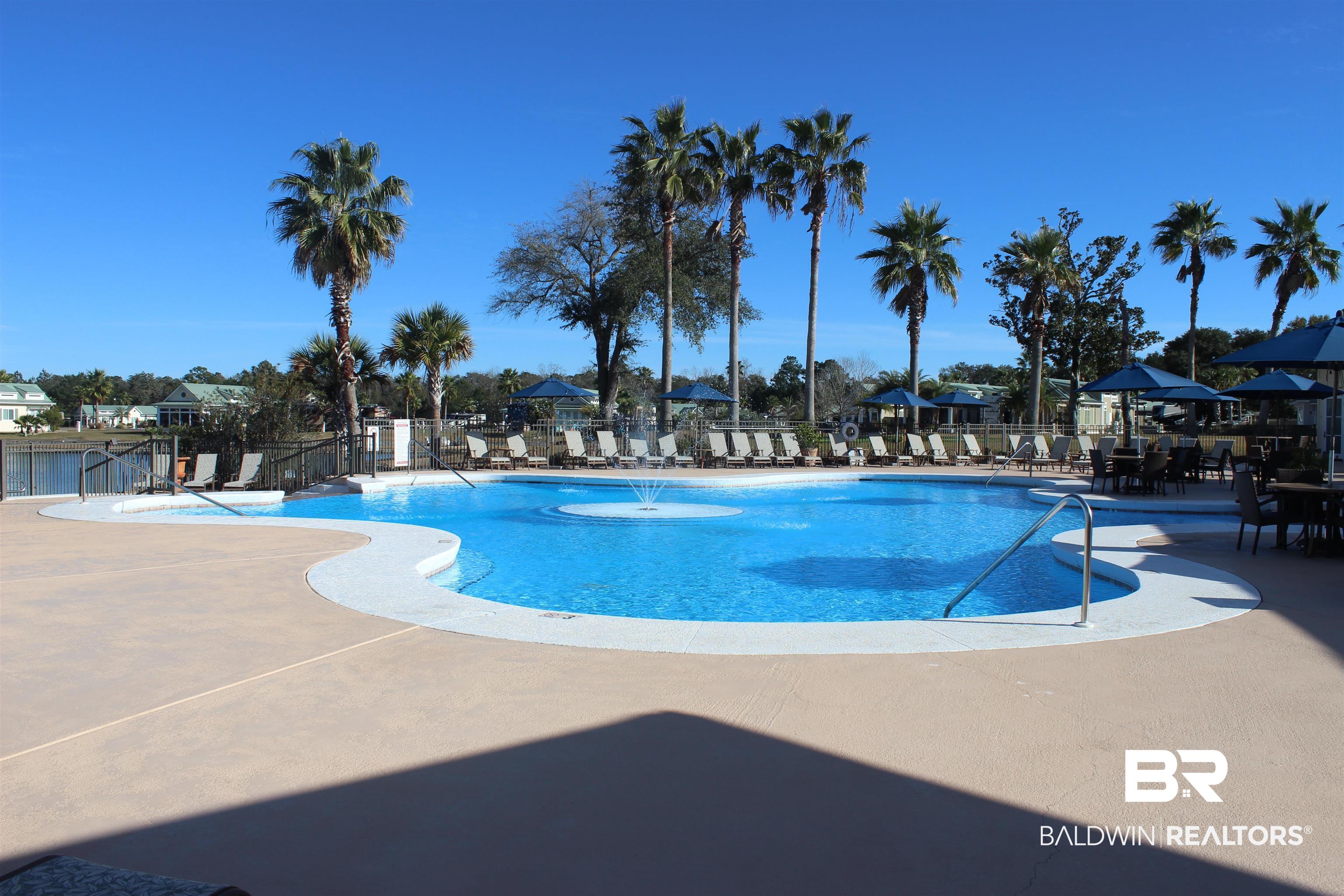 12489 Gateway Drive Elberta, AL 36530 - Photo 29 of 55 Pool featuring a patio and fence