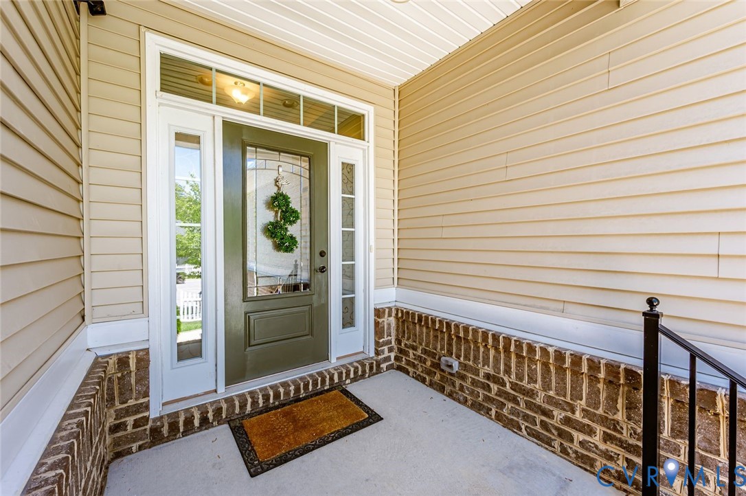 7435 Wicks Road Williamsburg, VA 23188 - Photo 7 of 82 Covered front porch featuring a decorative glass p