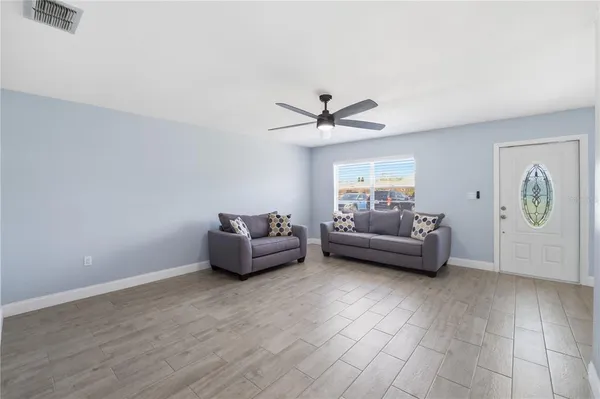 a living room with furniture and a window