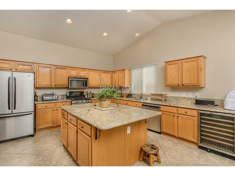 171 Ruby Ridge Avenue Henderson, NV 89002 - Photo 7 of 22 Property Photo. Granite counters, built in wine refrigerator