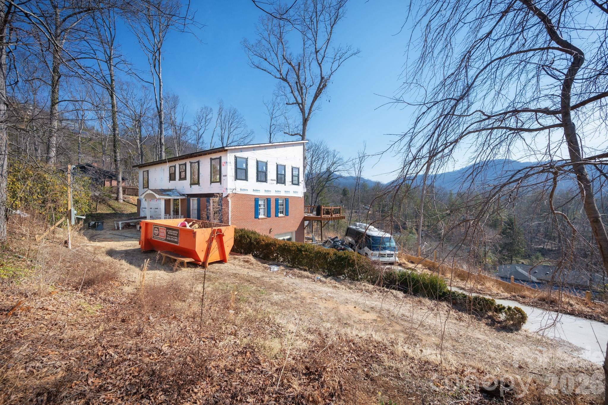 59 Faircrest Road Asheville, NC 28804 - Photo 3 of 24 a view of a house with yard and sitting area