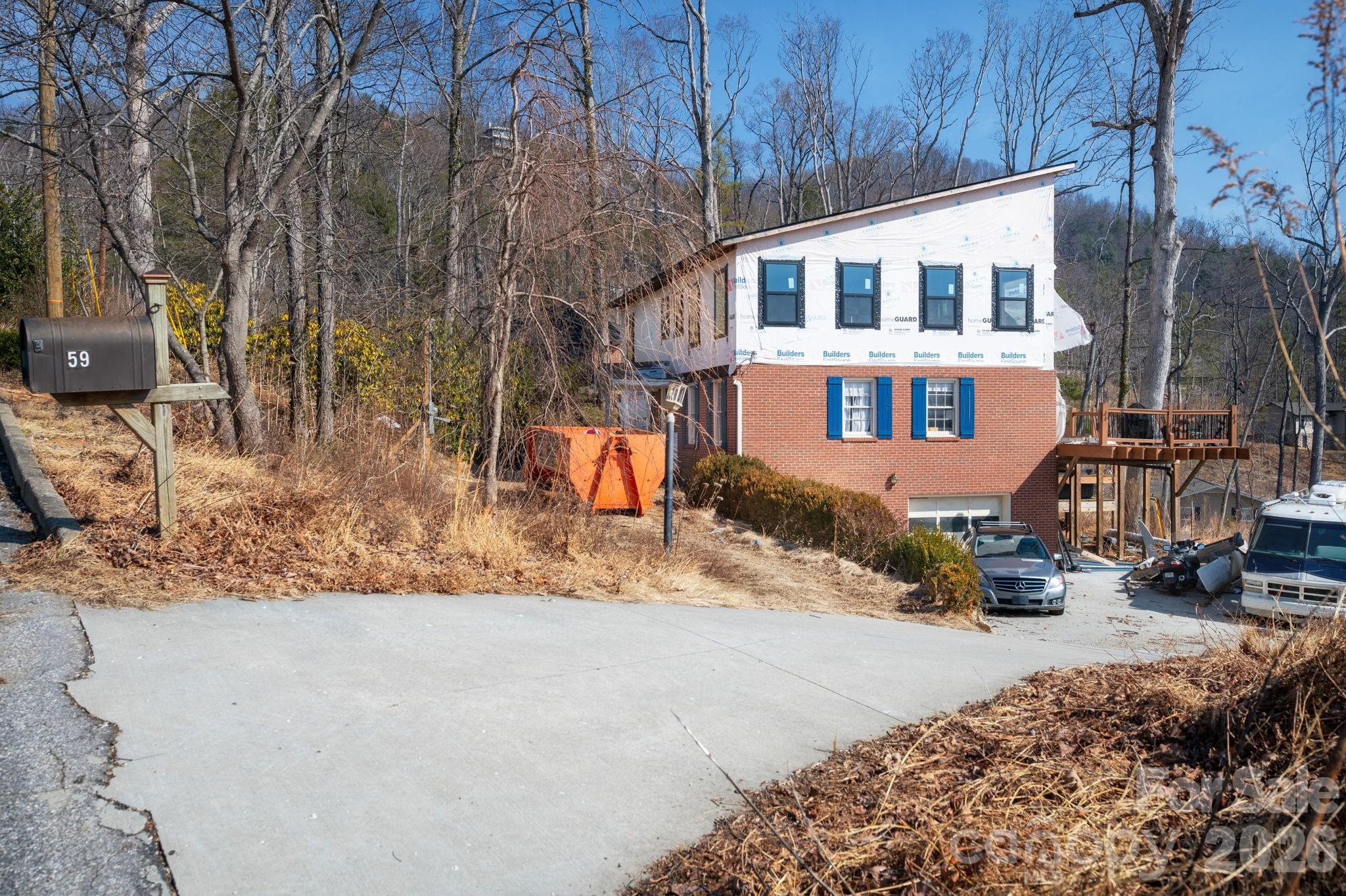 59 Faircrest Road Asheville, NC 28804 - Photo 4 of 24 a front view of a house with a yard