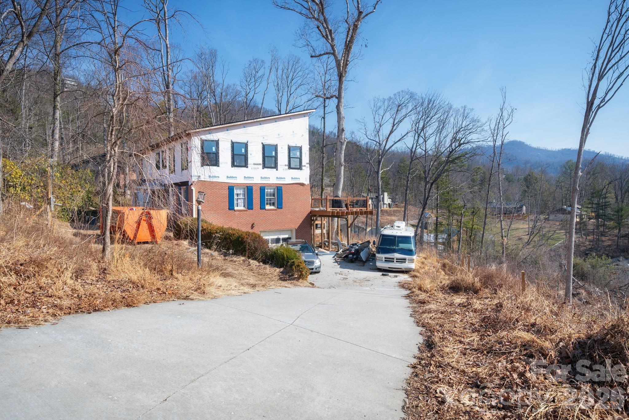 59 Faircrest Road Asheville, NC 28804 - Photo 5 of 24 a view of a house with a yard covered in snow