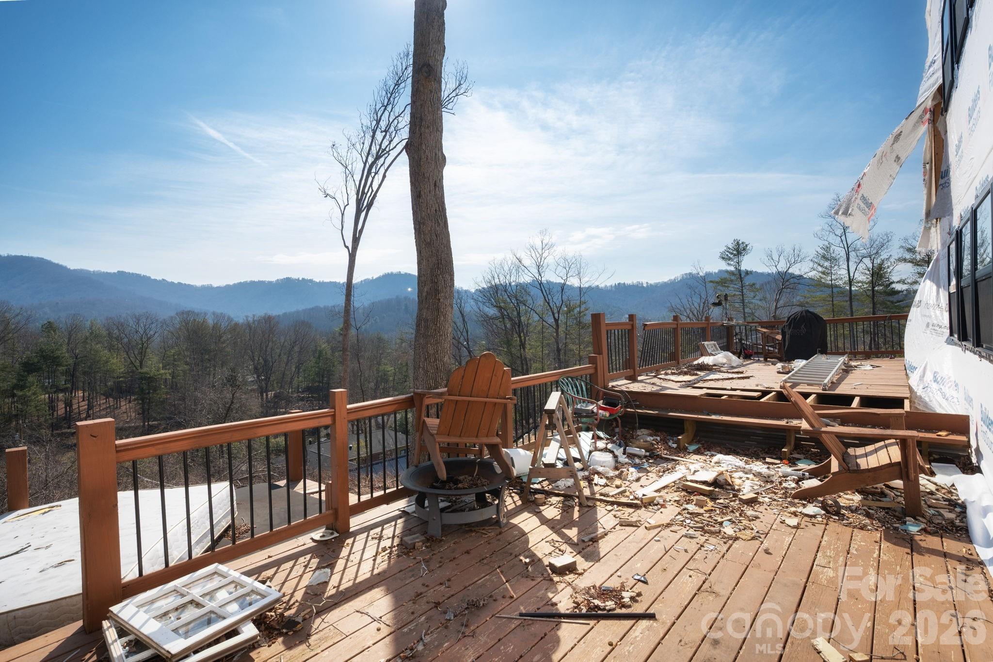 59 Faircrest Road Asheville, NC 28804 - Photo 7 of 24 a view of a balcony with mountain view and wooden floor
