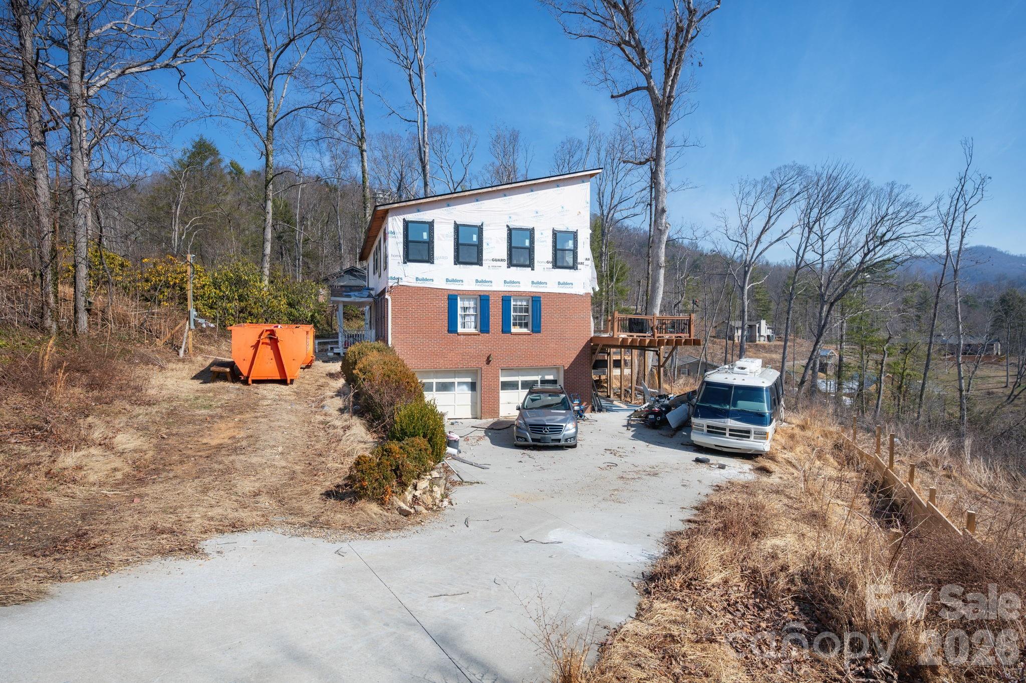 59 Faircrest Road Asheville, NC 28804 - Photo 9 of 24 a backyard of a house with fire pit and outdoor seating