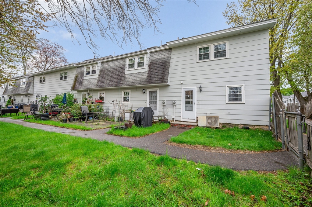 43 Constitution Way, Unit 43 Methuen, MA 01844 - Photo 24 of 25 a view of a house with a backyard