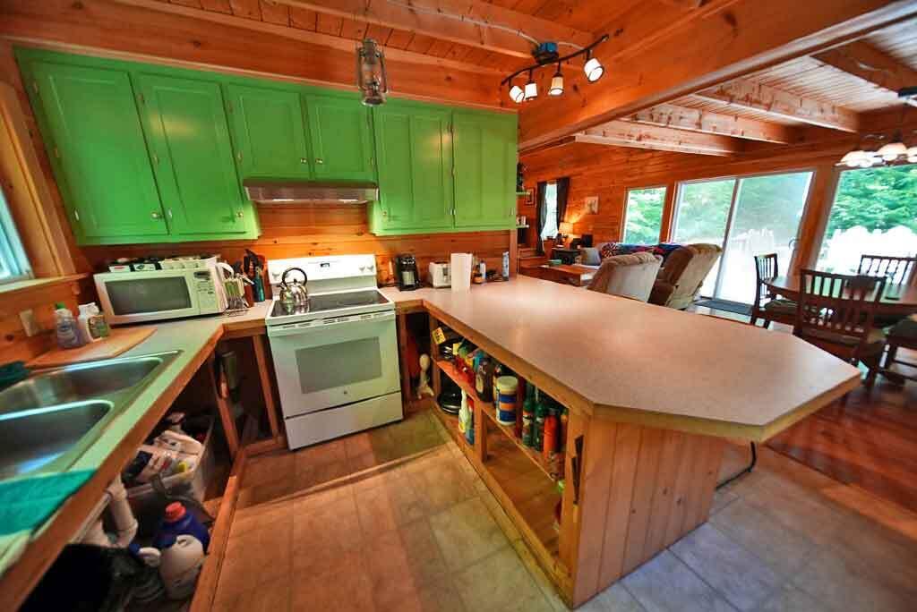 323 Sandy Beach Road Danforth, ME 04424 - Photo 47 of 81 kitchen-table-bar-lake-hous