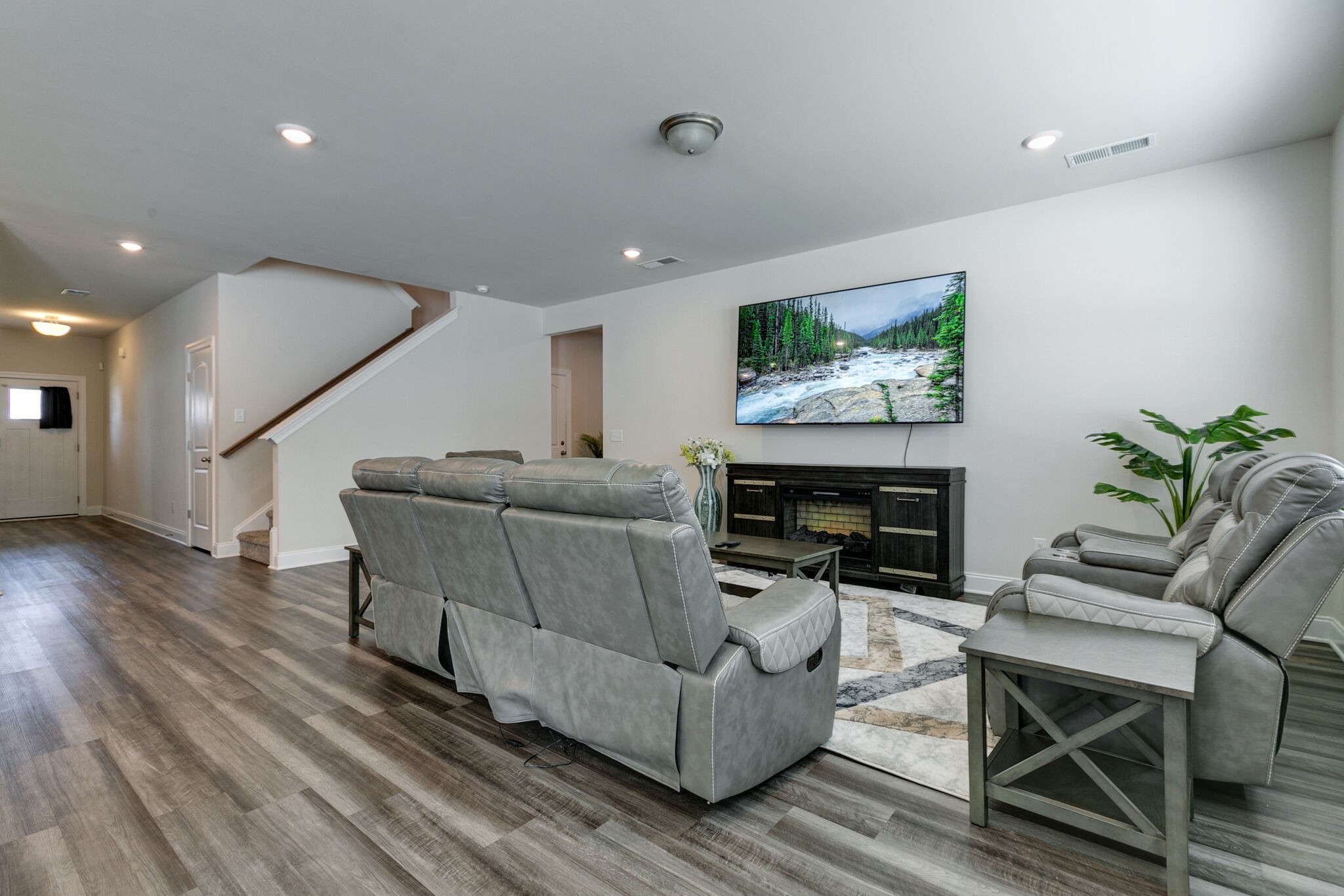 3264 Longstalk Road Antioch, TN 37013 - Photo 15 of 49 a living room with furniture a fireplace and a flat screen tv