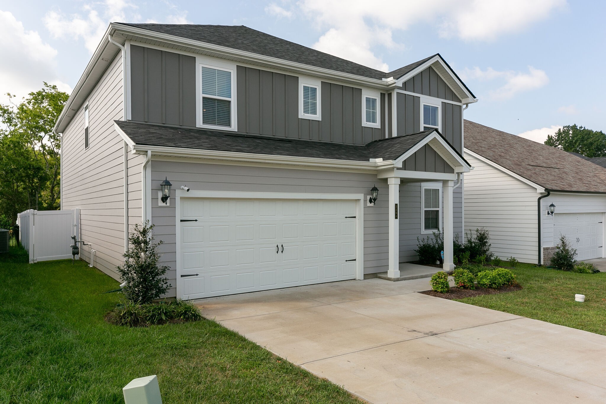3264 Longstalk Road Antioch, TN 37013 - Photo 2 of 49 a front view of a house with a yard and garage