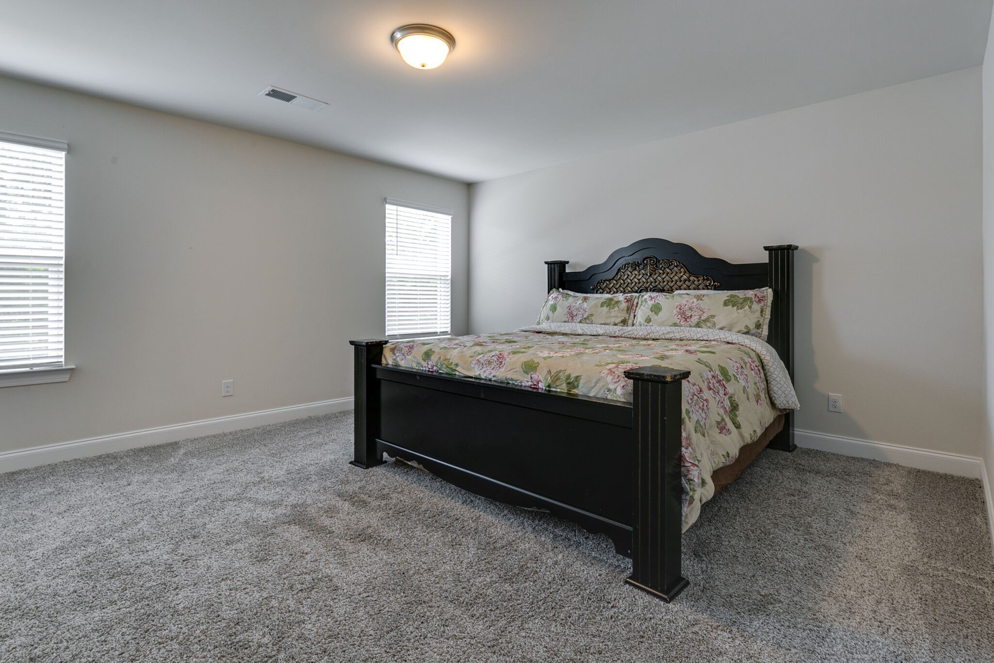 3264 Longstalk Road Antioch, TN 37013 - Photo 28 of 49 a bed sitting in a bedroom next to a window