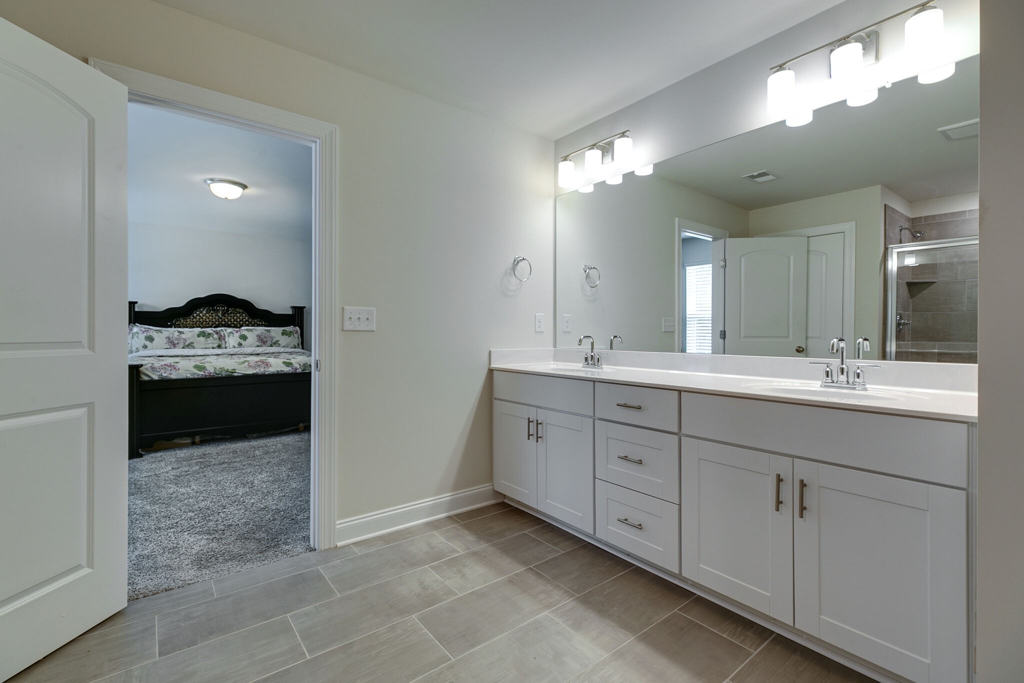 3264 Longstalk Road Antioch, TN 37013 - Photo 31 of 49 a spacious bathroom with double vanity and a mirror