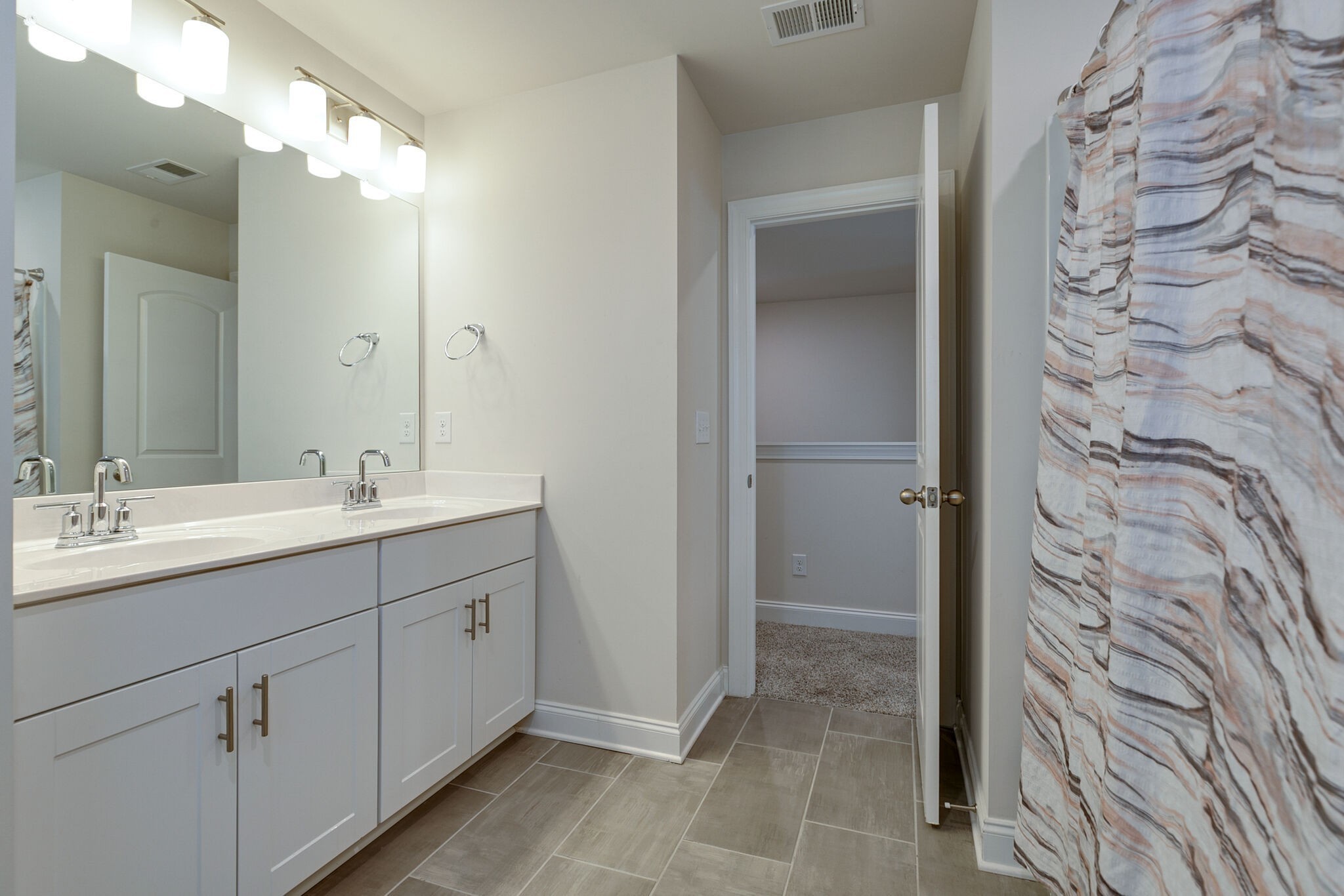 3264 Longstalk Road Antioch, TN 37013 - Photo 40 of 49 a bathroom with a double vanity sink and mirror