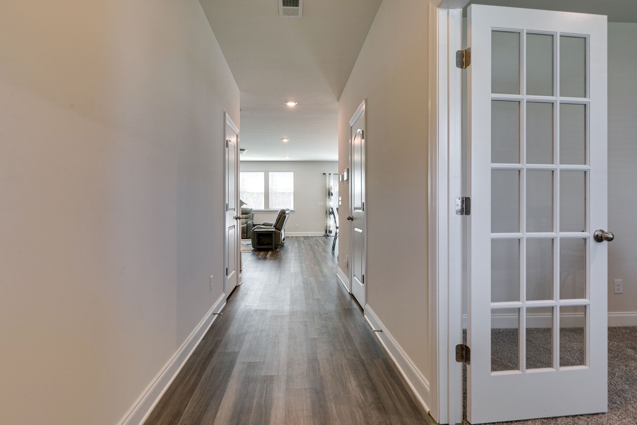 3264 Longstalk Road Antioch, TN 37013 - Photo 4 of 49 a view of a hallway with wooden floor and furniture