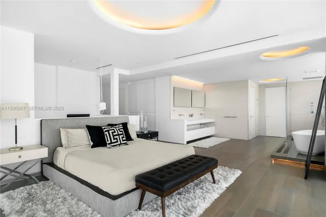 a bedroom with a bed and a chair