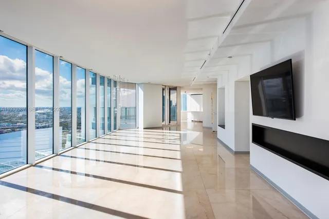 a living room with furniture and white walls