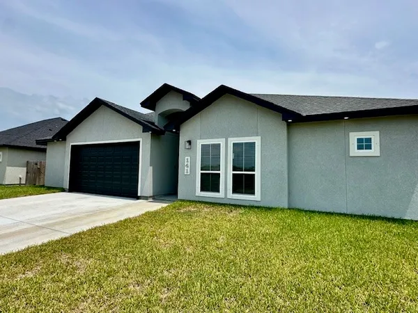 a house with yard in front of it