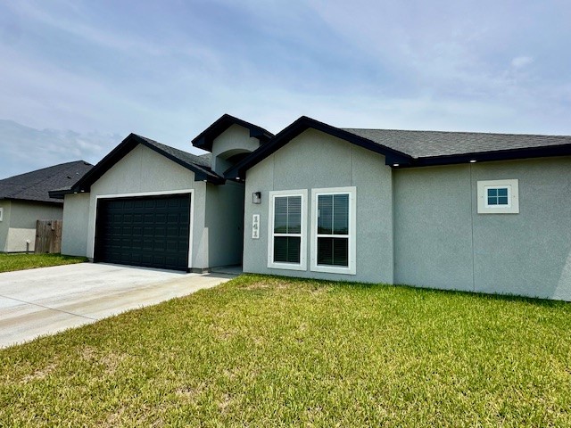 a house with yard in front of it