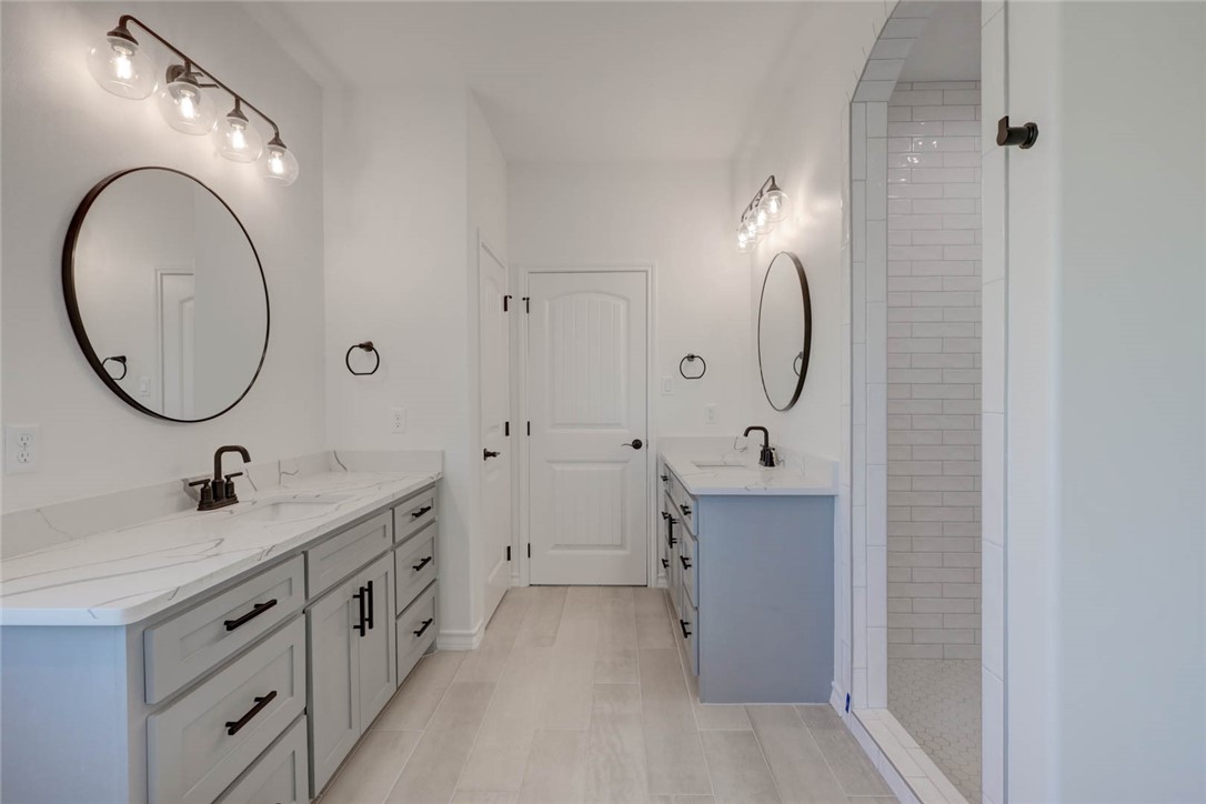 141 Amethyst Street Portland, TX 78374 - Photo 16 of 22 a bathroom with a sink double vanity and a mirror