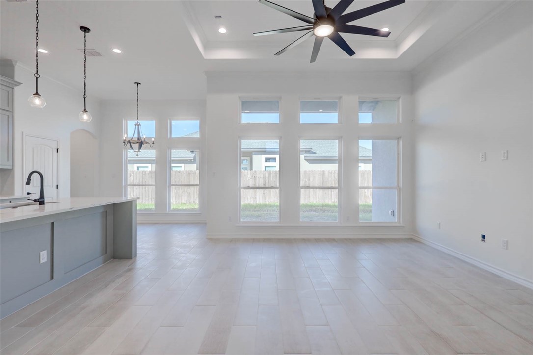 141 Amethyst Street Portland, TX 78374 - Photo 3 of 22 a view of an empty room with window and wooden floor